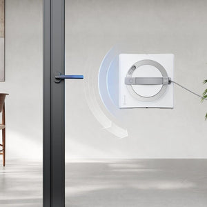 Modern interior design with a glass door and wall-mounted device.