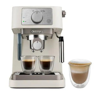 DeLonghi Stilosa cream espresso machine with dual shot glasses and milk frother, featuring stainless steel portafilter and control dial