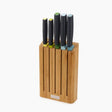 Joseph Joseph Elevate knife block set with five knives featuring black handles and colored accents in yellow, green and blue, displayed in a natural bamboo wooden block holder