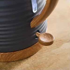 Morphy Richards Clay Flint grey jug kettle with wooden handle and spout detail on wooden surface