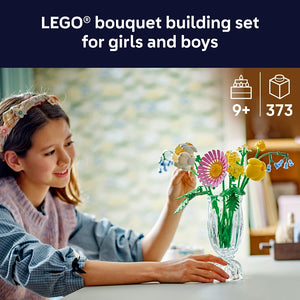 Girl smiling while arranging colorful LEGO flowers in a clear glass vase, featuring purple, yellow, and white blooms with green stems, LEGO Petite Sunny Bouquet building set for ages 9 plus with 373 pieces