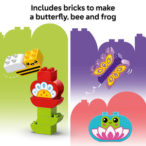 LEGO Creative Garden and Flowers set 10444 featuring colorful brick-built characters including a smiling yellow and black bee with white bricks, a red flower with yellow center and blue petals, a purple butterfly with yellow spotted wings, and a green and blue frog on a pink lotus flower, displayed against gradient colored backgrounds of green, purple and pink