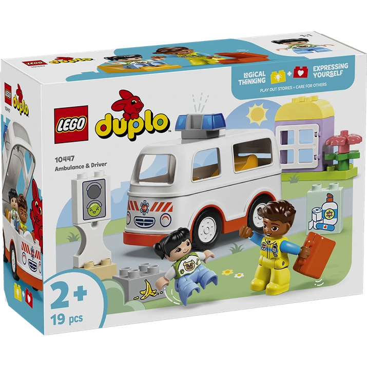 LEGO Duplo Ambulance and Driver set 10447 featuring a white and red ambulance vehicle, two child figures in yellow and blue outfits, accessories including a banana and medical items, displayed with packaging box against white background
