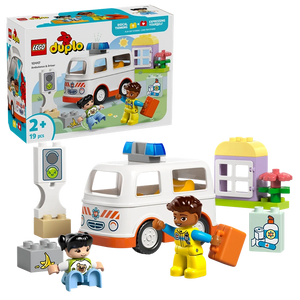 LEGO Duplo Ambulance and Driver set 10497 featuring white and orange ambulance vehicle with blue roof, two minifigures in yellow and blue outfits, traffic light, medical supplies, and colorful building blocks on green base, 19 pieces for ages 2 and up