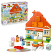 LEGO Duplo Bluey's Family House set 10459 featuring a red-roofed orange and cream house with blue doors, minifigures including Bluey characters, furniture pieces, and a memory game board on green baseplate