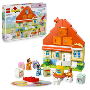 LEGO Duplo Bluey's Family House set 10459 featuring a red-roofed orange and cream house with blue doors, minifigures including Bluey characters, furniture pieces, and a memory game board on green baseplate