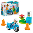 LEGO Duplo Blue Police Motorcycle set 10471 featuring a blue police motorcycle with white-helmeted officer minifigure, orange traffic cones, red flower, green base blocks, and traffic light with smiley face, 11 pieces for ages 2 plus