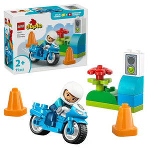 LEGO Duplo Blue Police Motorcycle set 10471 featuring a blue police motorcycle with white-helmeted officer minifigure, orange traffic cones, red flower, green base blocks, and traffic light with smiley face, 11 pieces for ages 2 plus
