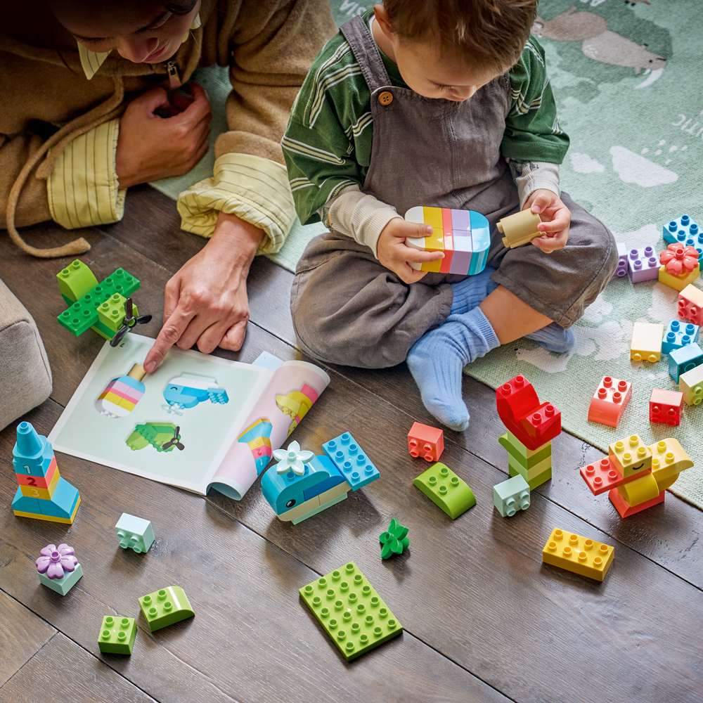 LEGO DUPLO Classic Colorful Creative Box 10479 - a child building the set. 80 pieces. Ages 1½+.