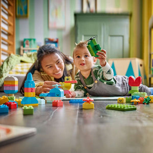 LEGO DUPLO Classic Colorful Creative Box 10479 - a child playing with the finished build. 80 pieces. Ages 1½+.