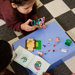 LEGO Bluey Grannies with Bingo and Bluey 11216 - a child building the set. 80 pieces. Ages 4+.