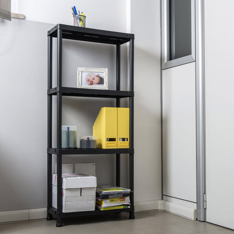 Black metal shelf with various items against a white wall