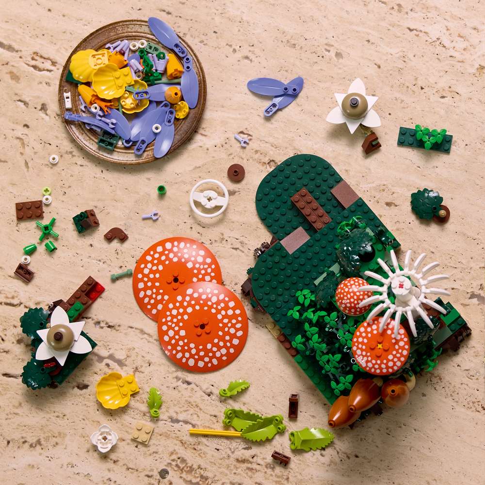 LEGO Botanicals Woodland Mushrooms 11505 - a child building the set. 806 pieces. Ages 18+.
