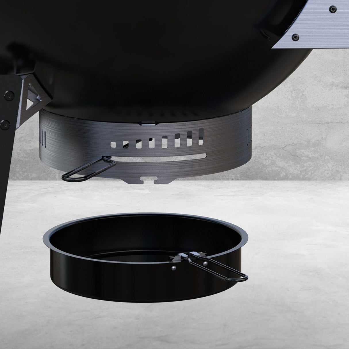 Black charcoal BBQ grill with curved metal hood featuring ventilation slots, removable ash pan, and side handles on concrete surface