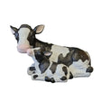 Large black and white painted resin cow and calf garden ornament in sitting position, featuring detailed hand-painted markings and a rustic finish, isolated on white background