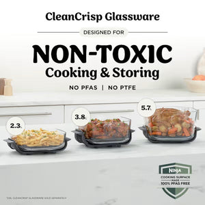 CleanCrisp Glassware product display showing three non-toxic glass cooking and storage containers in black frames with capacities of 2.3, 3.8, and 5.7 liters, filled with prepared food dishes, featuring PFAS and PTFE-free Ninja cooking surface branding