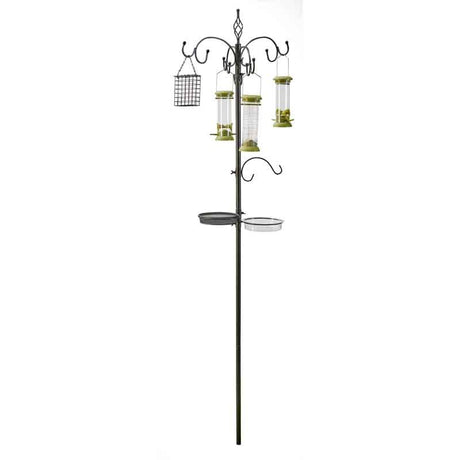 Black metal bird feeding station with multiple hanging feeders, wire mesh suet cage, and two circular trays on curved arms, featuring green accents on feeder tops and a tall central pole