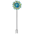 Decorative peacock solar wind spinner with vibrant blue and green feathered design, yellow accents, long black metal stake pole for garden display