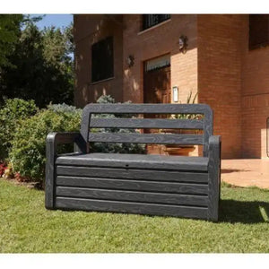 Toomax Storaway anthracite garden storage bench with 263 litre capacity positioned on lawn in front of brick house with open lid showing interior storage space