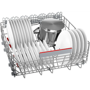 Bosch Series 6 integrated dishwasher with open basket showing white plates, stainless steel pot, and red handle detail inside metal wire racks