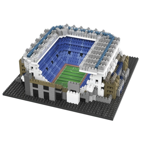 Model of a stadium made from interlocking bricks on a white background