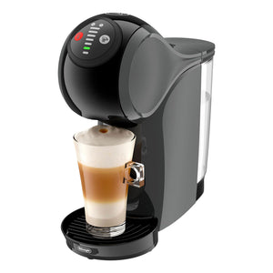 Black coffee machine with a glass of layered coffee on a white background