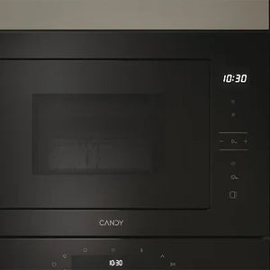 Candy 20 litre built-in microwave with grill in stainless steel and black finish, displaying digital time display at 10:30 with control buttons on right side