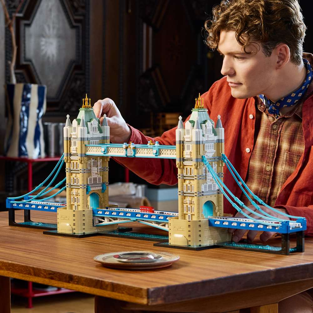 LEGO Architecture Tower Bridge 21067 - a child playing with the finished build. 3745 pieces. Ages 18+.