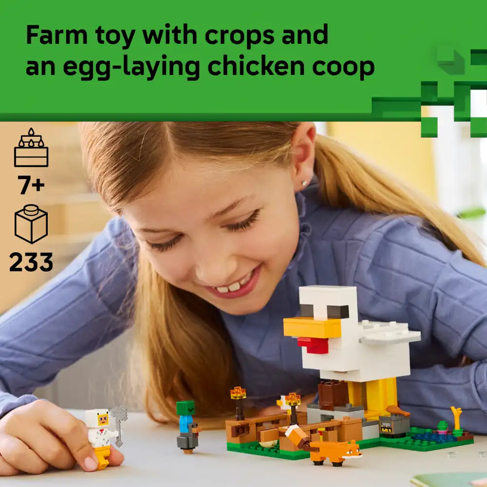 Young girl with reddish-brown hair playing with LEGO Minecraft Chicken Farm set featuring a white pixelated chicken coop, colorful building blocks in green, yellow, orange and brown, small LEGO figures and farm animals on a white surface, with green farmland base, age 7+ rating and 233 piece count displayed