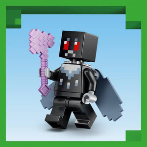 LEGO Minecraft Wither minifigure in black with red pixelated eyes holding a pink diamond pickaxe against a light blue background with green border frame