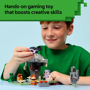 Young boy in green shirt playing with LEGO Minecraft The Pale Garden set, holding a purple character figure above a constructed scene featuring gray stone tower, green base plate, orange and brown blocks, and various Minecraft-themed pieces against light blue background