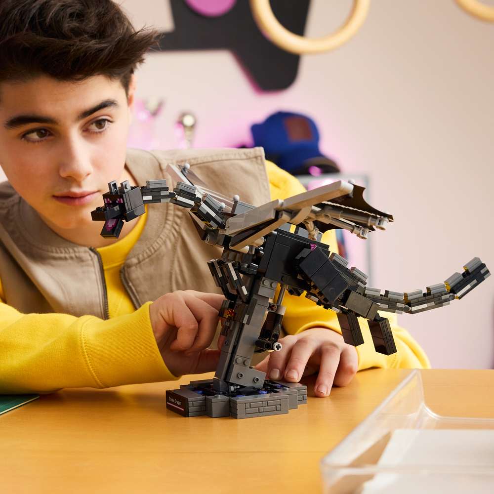 LEGO Minecraft The Ender Dragon 21595 - a child playing with the finished build. 710 pieces. Ages 10+.