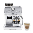 DeLonghi La Specialista Arte Bean to Cup Coffee Machine in white color with a cup of coffee beside it.