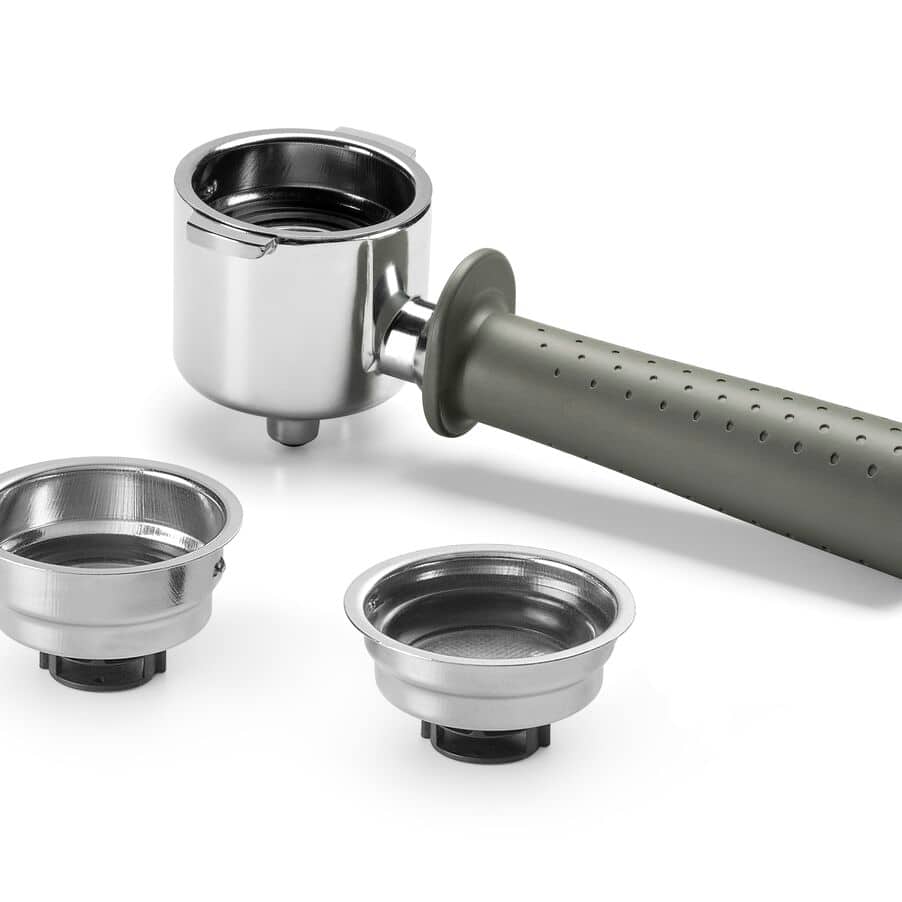 DeLonghi Stilosa espresso machine components including chrome portafilter with gray handle, two metal filter baskets, and stainless steel group head on white background