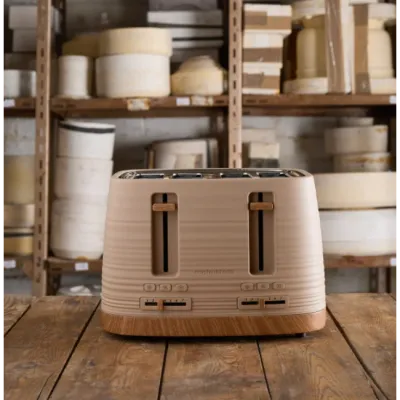 Morphy Richards Clay Felspar 4 slice toaster with cream and wood finish on wooden surface with kitchen storage shelving in background