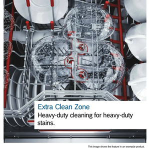 Interior view of Bosch Series 6 dishwasher showing Extra Clean Zone feature with two spray arms actively cleaning heavily soiled plates, demonstrating heavy-duty water jets and red mechanical components against stainless steel drum