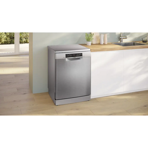 Bosch Series 6 stainless steel freestanding dishwasher with 14 place setting capacity positioned in a modern kitchen with white cabinetry, wooden countertop and natural lighting from adjacent windows