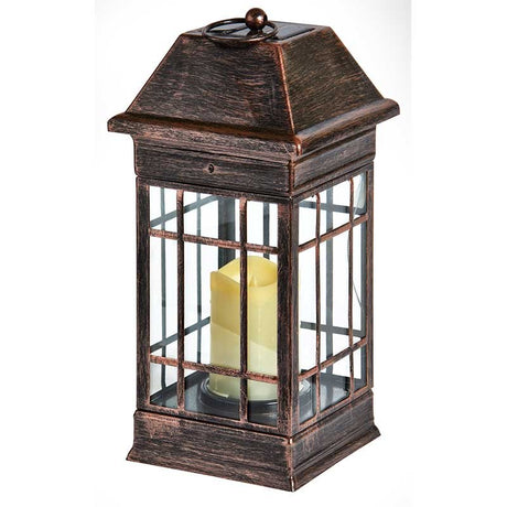 Solar-powered Seville lantern with dark bronze finish, pyramidal roof, gridded glass panels, and LED candle light inside