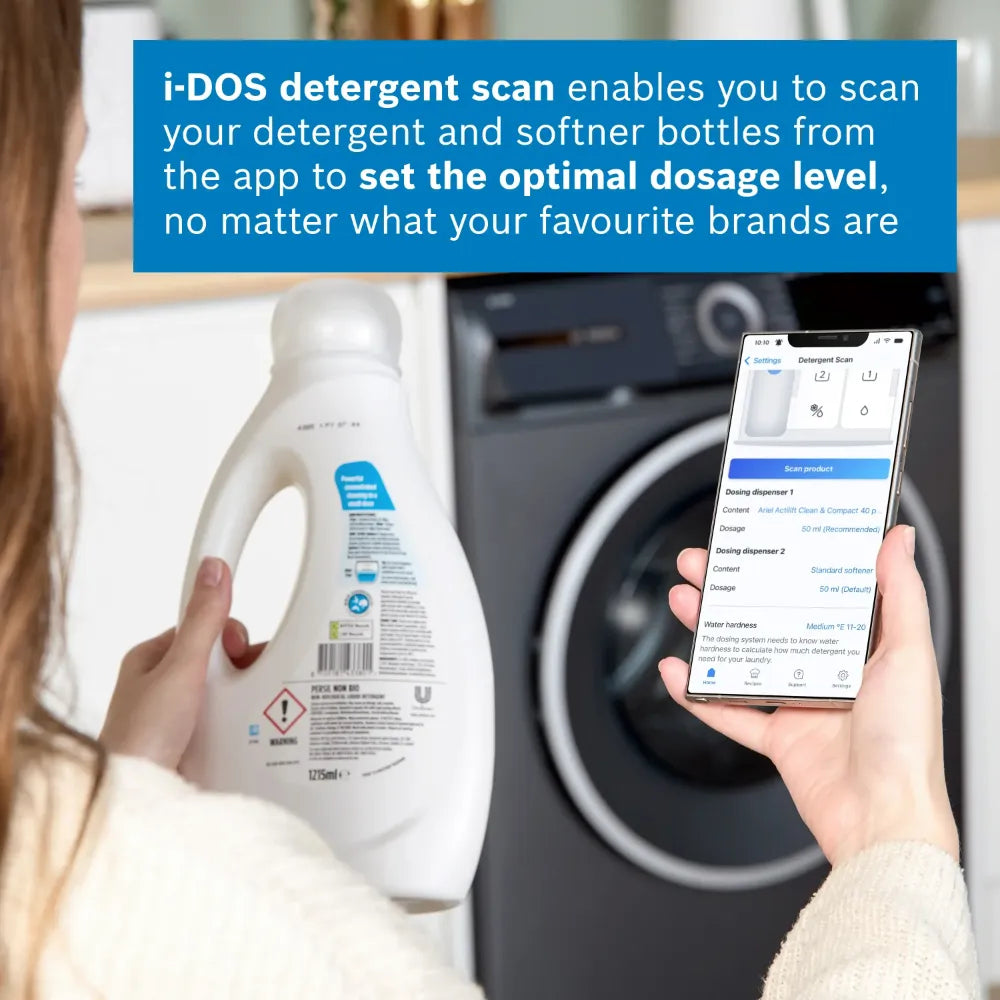 Woman holding white detergent bottle and smartphone displaying i-DOS detergent scan app interface in front of dark grey Bosch washing machine, showing optimal dosage level technology for laundry care