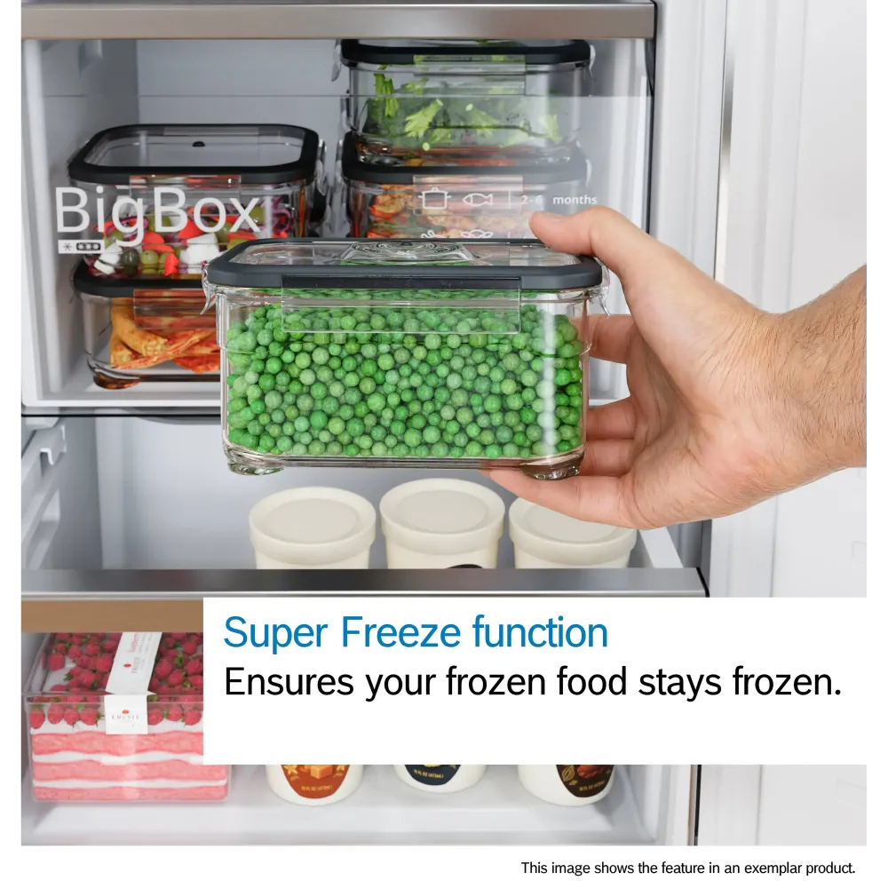 Bosch Series 2 fridge freezer with Super Freeze function demonstration showing a hand holding a clear plastic container of frozen green peas with black lid, displaying organized freezer compartment containing various food storage containers and frozen items