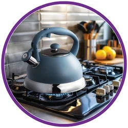 Gray kettle on a gas stove 