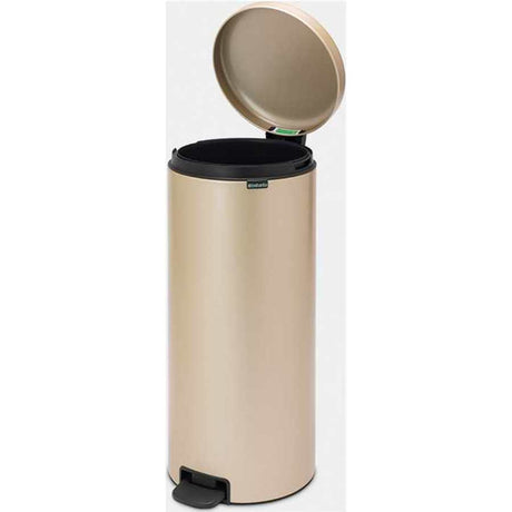 Brabantia 30 litre New Icon pedal bin in champagne with black lid and foot pedal, cylindrical stainless steel design with open lid displayed against white background