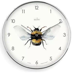 Acctim Society Bee analogue wall clock with silver frame featuring a watercolor illustration of a bumblebee with yellow and black stripes and translucent wings at the center, surrounded by numbered dial markers 1-12 on a cream face