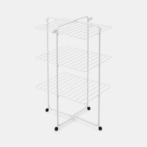 White metal clothes airer tower with three horizontal shelves, X-frame base with four black caster wheels, featuring 23 metres of drying space with parallel drying rails