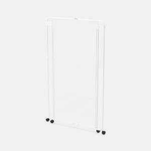 White Brabantia Hang On Tower clothes airer with horizontal drying rails and black caster wheels on a light background