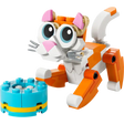 LEGO Creator 3 in 1 orange and white cat building set with pink ears and bow, featuring articulated orange limbs and joints, displayed with turquoise and yellow circular base plate component