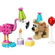 LEGO Creator Cute Animal Birthday Party set 30715 featuring a pink flamingo with green party hat, tan dog character with blue cone hat, white candle with flame, yellow gift box, and red balloon on white stand arranged on colorful base pieces