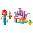 LEGO Disney Ariel and Flounder's Birthday Music Fun set featuring red-haired mermaid minifigure with purple bikini top and turquoise tail holding gold saxophone, colorful castle structure with purple towers pink details yellow base blue platform white keyboard and purple organ pipes, and yellow Flounder fish minifigure