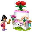 LEGO Friends Flower Stand set 30721 featuring a minifigure with black hair in colorful outfit, golden scissors, pink and white flower cart with red roses, pink blooms, cream flowers in tan pots, white daisy details, and green baseplate