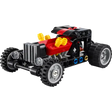 LEGO Technic Hot Rod Car 30723 with red engine block, black and red chassis, yellow exhaust pipes, silver and black wheels, and blue and gold accent details against white background